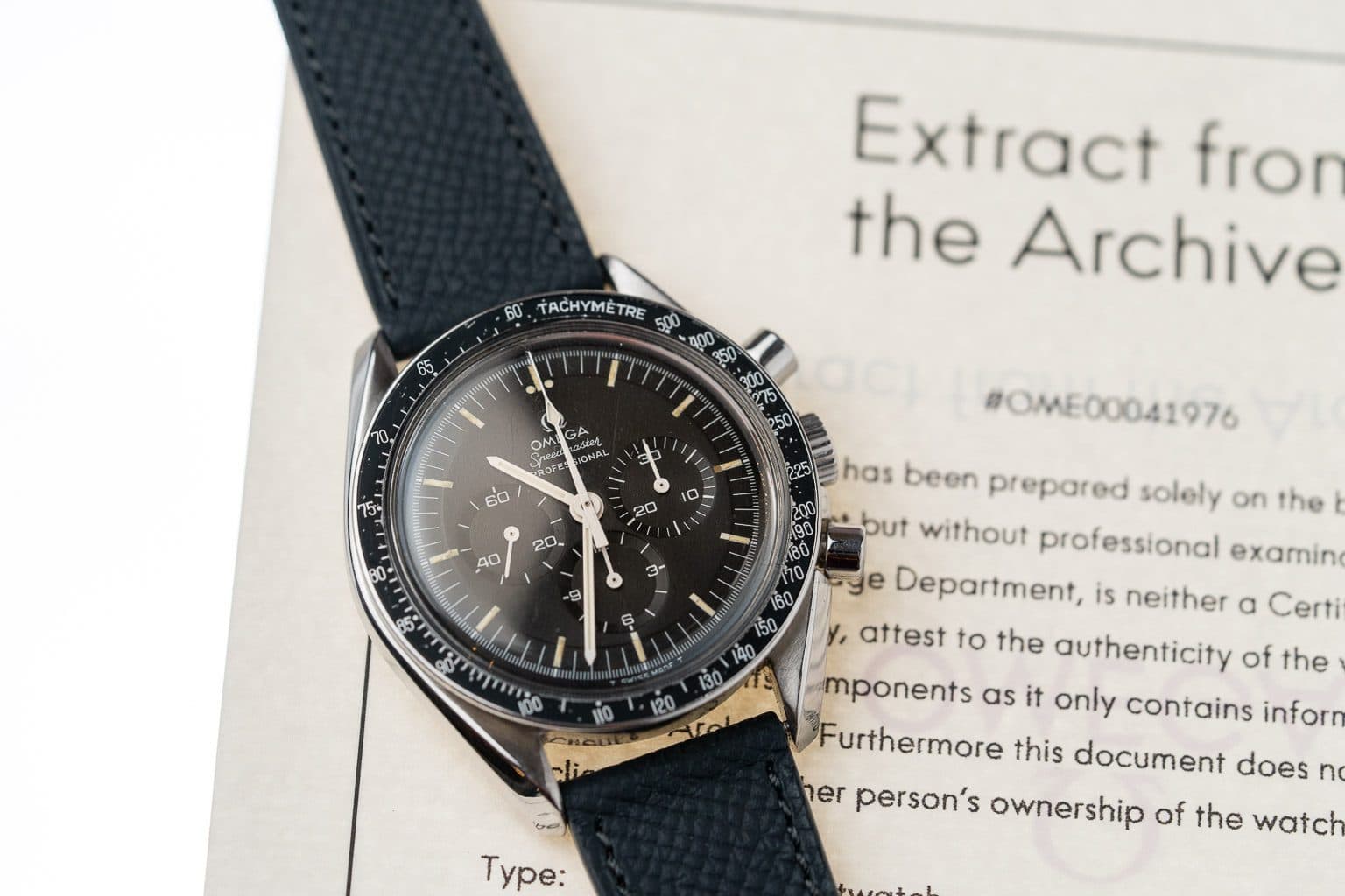 Chronograph resting on an archive extract