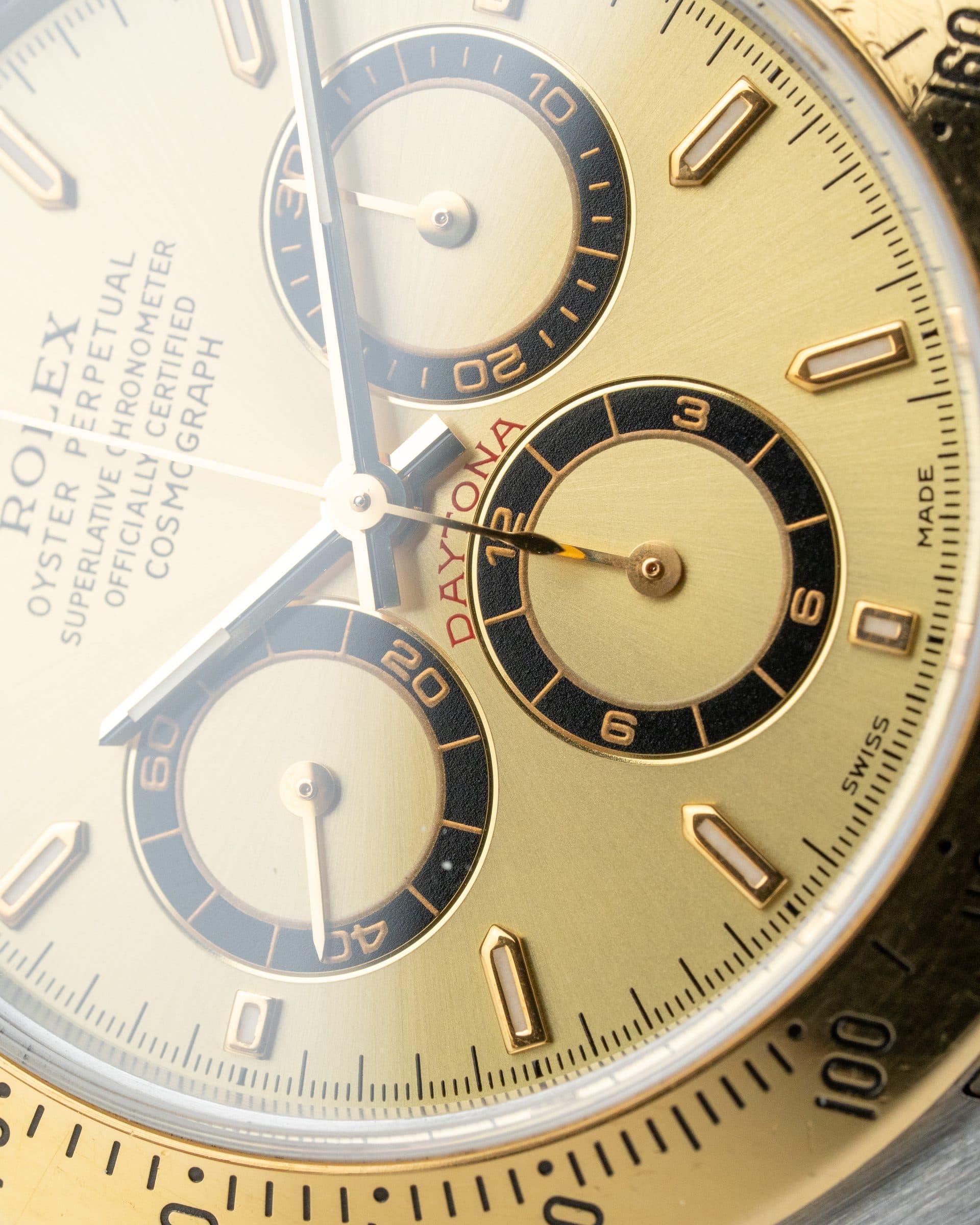 The dial of a gold Daytona up close